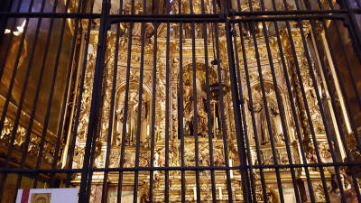 The rooms behind the iron bars are personal chapels of the well-to-do families who attended the church.